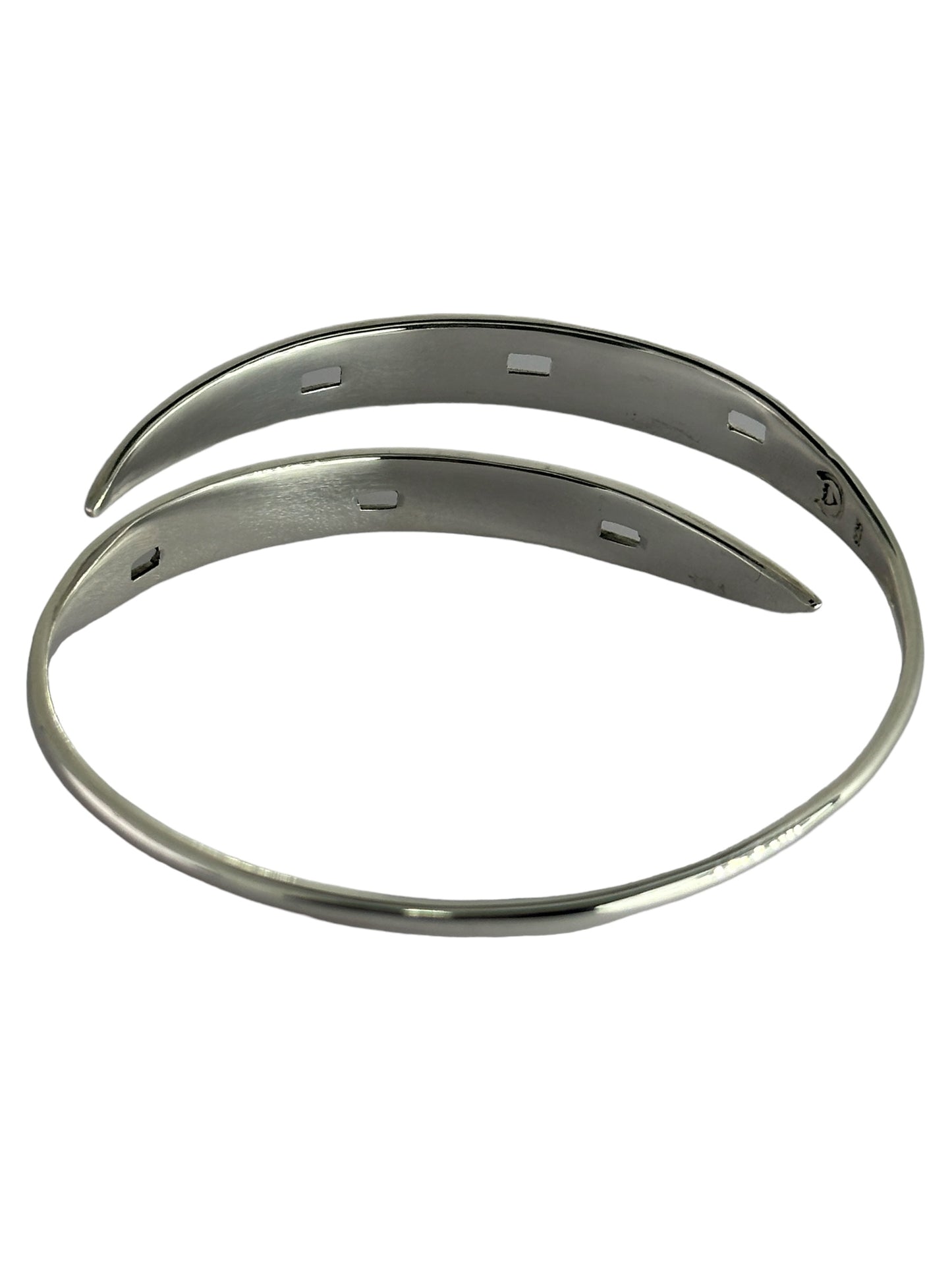 Open design of hand-forged silver horseshoe bangle