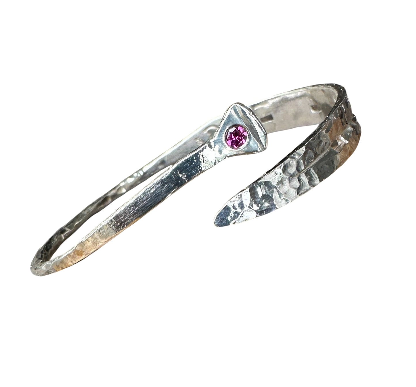 Silver bracelet with a pink gemstone on a white background