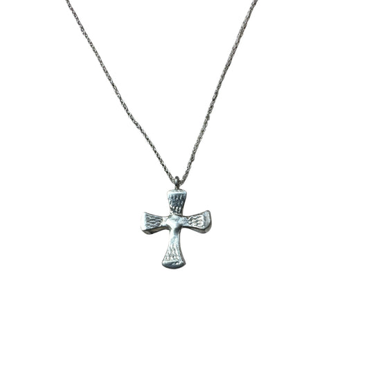 A sterling silver cross pendant with a chain, made from sandcast horseshoe nails